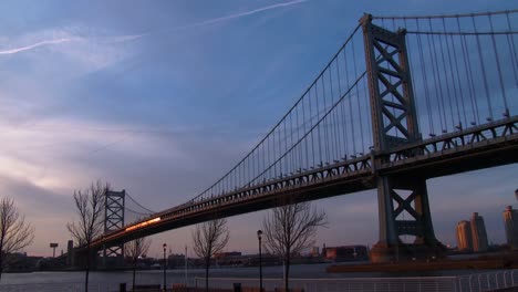 A-commuter-train-crosses-the-Ben-Franklin-Bridge-near-Philadelphia-PA