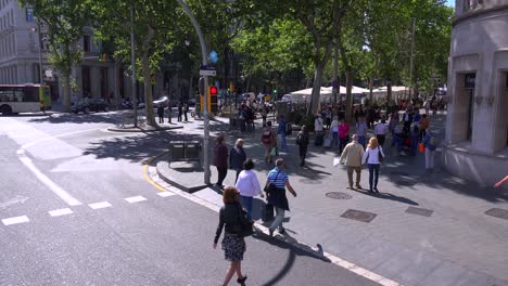 High-angle-over-a-Barcelona-Spain-intersection-with-pedestrians-crossing-street