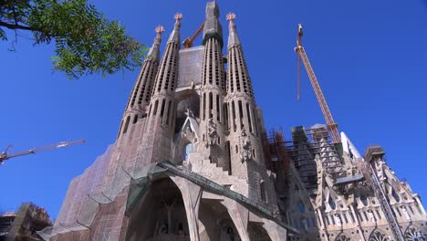 Low-angle-view-of-the-Sagrada-Familia-cathedral-by-Gaudi-in-Barcelona-Spain