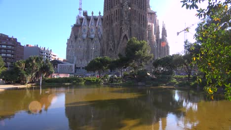 Tilt-up-to-view-of-Sagrada-Familia-cathedral-by-Gaudi-under-construcción-in-Barcelona-Spain
