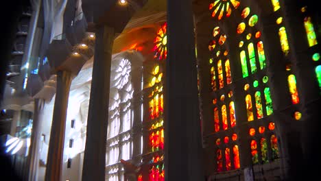 Sunlight-streams-through-stained-glass-in-the-beautiful-interior--of-the-Sagrada-Familia-Cathedral-by-Gaudi-in-Barcelona-Spain