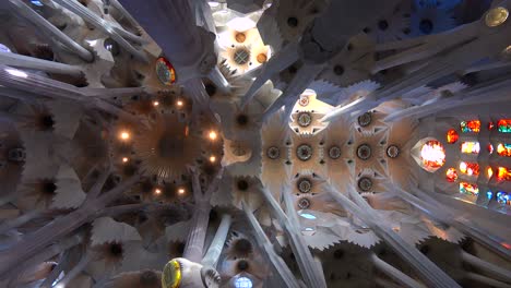 Low-angle-looking-at-the-ceiling-in-the-beautiful-interior--of-the-Sagrada-Familia-Cathedral-by-Gaudi-in-Barcelona-Spain