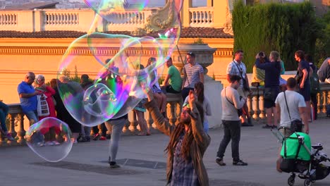 A-performance-artist-makes-large-bubbles-in-Barcelona-Spain