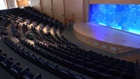 A-beautiful-auditorium-at-an-oceanographic-institute-features-an-aquarium-display