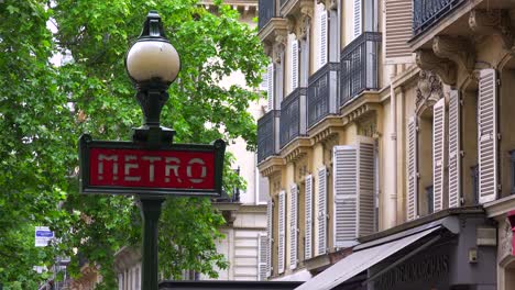 A-metro-subway-sign-on-a-street-in-paris-France