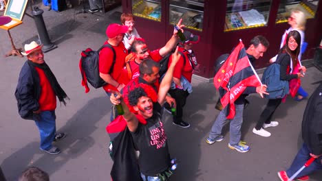 Rowdy-football-fans-celebrate-on-a-city-street-in-Europe