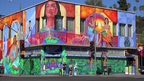 A-building-in-downtown-Los-Angeles-is-brightly-painted-with-murals-and-graffiti-1