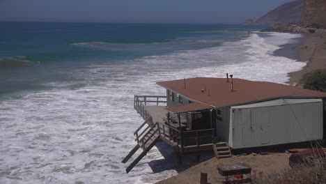A-building-along-the-Malibu-coastline-collapses-into-the-sea-after-a-major-storm-surge