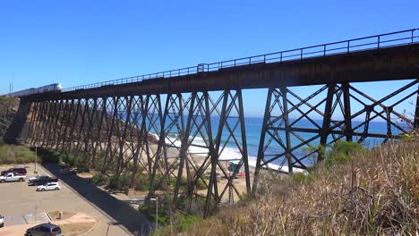 An-Amtrak-train-crosses-a-high-bridge-along-the-California-coast