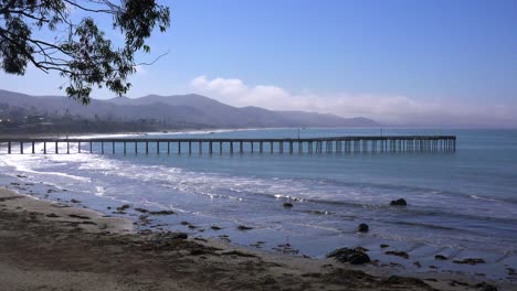 A-beautiful-pier-juts-out-into-the-ocean-along-the-California-Coast