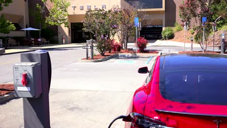 A-Tesla-electric-car-charging-in-front-of-Tesla-corporate-headquarters-1