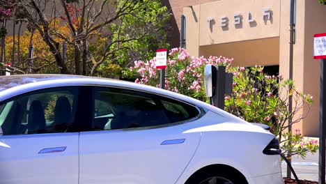 A-Tesla-electric-car-charging-in-front-of-Tesla-corporate-headquarters-2