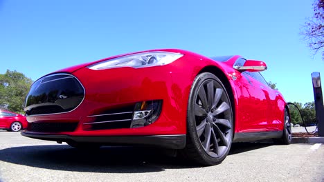Traveling-shot-around-the-front-of-a-Tesla-electric-car