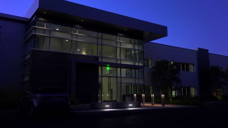 Establishing-shot-of-the-exterior-of-a-generic-modern-office-building-at-night
