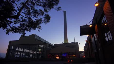 Wide-shot-of-a-large-warehouse-or-factory-at-dusk-or-sunset-3