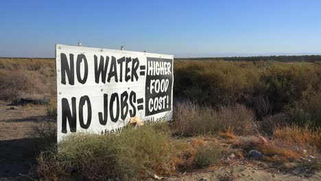 A-road-sign-warns-of-s-serious-drought-and-the-cost-to-California-in-jobs-and-food-1