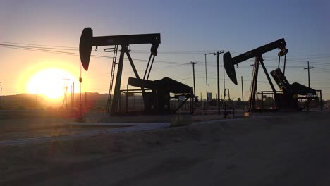 Oil-derricks-pump-against-the-sunset