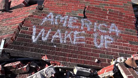 Graffiti-on-a-ruined-building-following-the-Ferguson-rioting-urges-America-to-wake-up