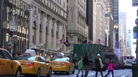 A-nice-shot-along-5th-avenue-in-New-York-City-with-pedestrians-and-traffic-1