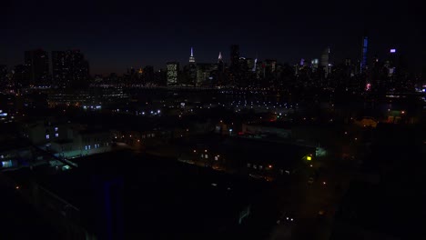 A-wide-angle-view-over-Queens-New-York-City-at-dusk-with-the-Manhattan-skyline-background-2