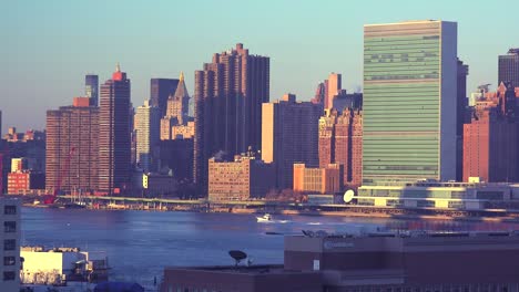 Early-morning-shot-of-the-New-York-City-Manhattan-skyline-with-the-United-Nations-building-in-the-foreground-and-boats-on-the-East-River
