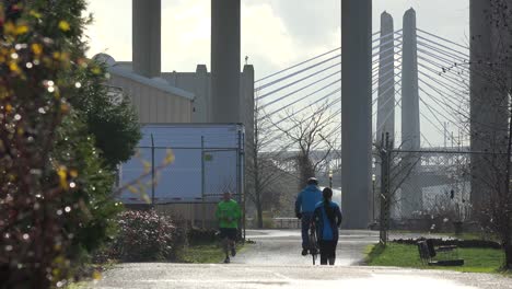 Joggers-and-cyclists-move-along-the-waterfront-in-Portland-Oregon