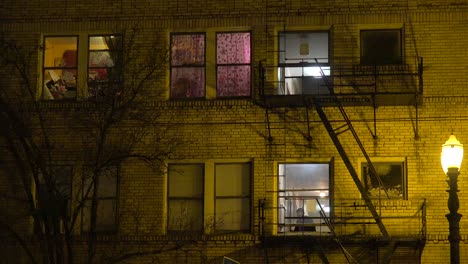 Generic-establishing-shot-of-an-urban-tenement-or-apartment-complex-at-night