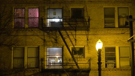 Generic-establishing-shot-of-an-urban-tenement-or-apartment-complex-at-night-1