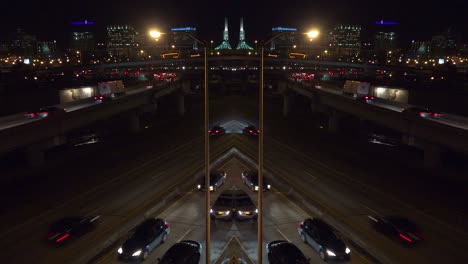 A-distorted-mirrored-shot-of-traffic-traveling-on-a-major-highway-or-freeway-at-night