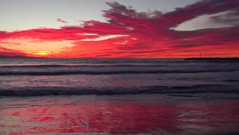 A-blood-red-sunset-illuminates-a-Southern-California-beach