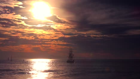 A-tall-clipper-ship-sails-at-sunset-2