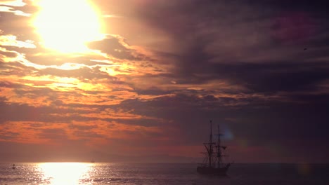 A-tall-clipper-ship-sails-at-sunset-3