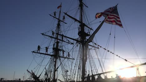 Sailors-stand-on-the-mast-of-a-tall-historic-clipper-ship-as-it-sails-on-the-ocean-1