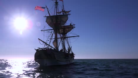 A-tall-masted-clipper-ship-sails-on-the-high-seas-against-the-sun-1