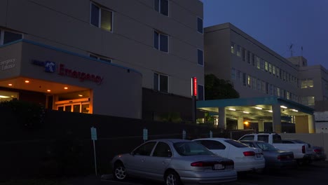 Establishing-shot-of-a-hospital-emergency-room-at-night