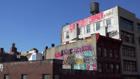 Graffitti-art-appears-on-the-side-of-a-building-against-the-skyline-in-New-York-City-1