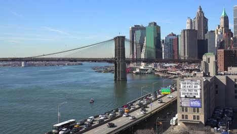 The-Brooklyn-Bridge-East-River-and-FDR-parkway-on-a-clear-sunny-day-in-New-York-City