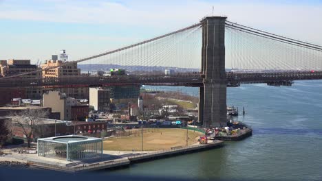 A-boat-passes-under-the-Brooklyn-Bridge-in-New-York-City-1