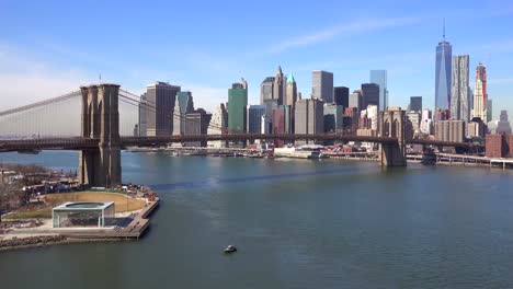 Nice-establishing-shot-of-New-York-City-financial-district-with-Brooklyn-Bridge-foreground-1