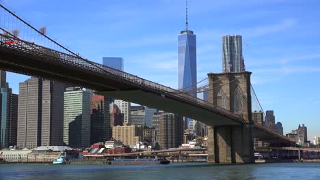 Establishing-shot-of-New-York-City-with-Brooklyn-Bridge-Freedom-Tower-and-East-River-1