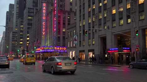 A-nice-establishing-shot-of-Radio-City-Music-Hall-in-New-York-City-with-traffic-passing-1