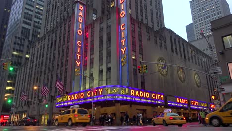 A-nice-establishing-shot-of-Radio-City-Music-Hall-in-New-York-City-with-traffic-passing-3