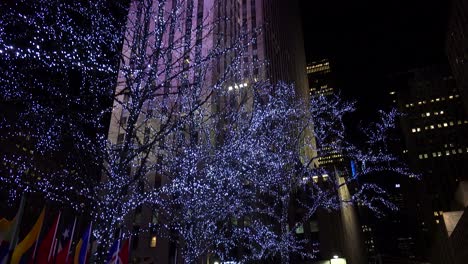 Tilt-up-shot-to-reveal-Rockefeller-Center-in-New-York-City-at-night