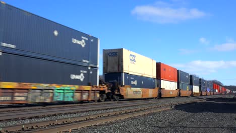 A-fast-moving-freight-train-passes-with-many-containers