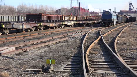 An-industrial-railyard-with-flatcars-and-tankers