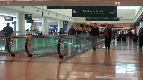 Passengers-walk-through-a-modern-airport-terminal