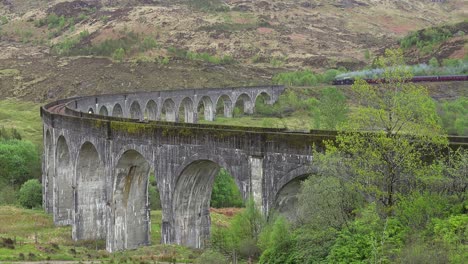 A-steam-train-passes-across-the-Glenfinnan-Viaduct-in-Scotland