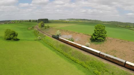 An-aerial-of-a-steam-train-as-it-passes-through-the-English-countryside-at-high-speed-2