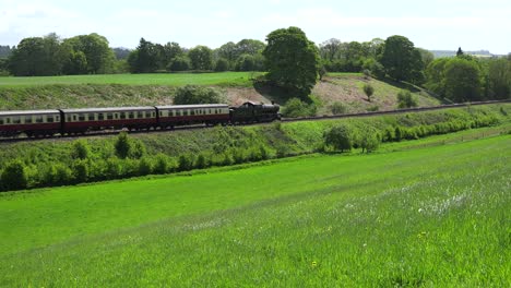 A-steam-train-passes-through-the-English-countryside-at-high-speed-1