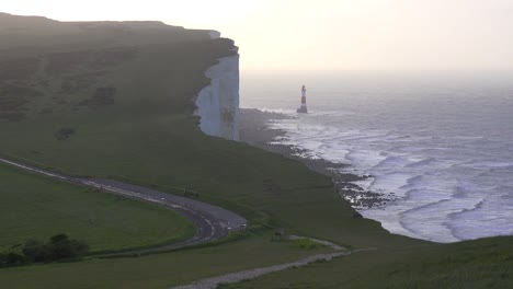 A-beautiful-establishing-shot-of-the-white-cliffs-of-Dover-at-beachy-head-England-with-lighthouse-
